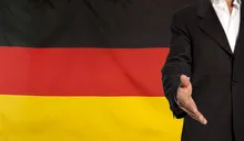 Open hand and Germany flag in the background