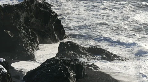 Waves Crashing On Rock Coast
