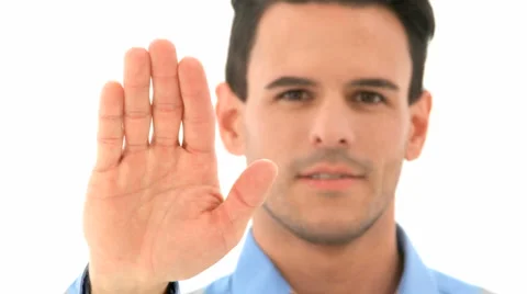 Man Smiling Shows Stop Sign With Hand