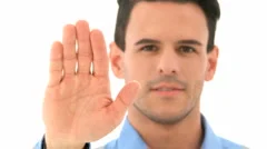 Man Smiling Shows Stop Sign With Hand