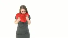 Woman throws heart pillow into the camera