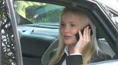 Business Woman Receives Call In Limousine