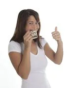 Woman Enjoys A Cup Of Espresso