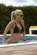 Beautiful Woman In A Swimming Pool During Summer