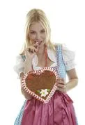 Woman Bites In An Empty German Gingerbread Heart