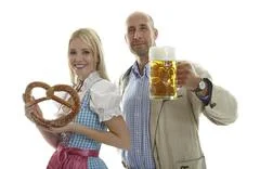 Woman In Dirndl And Man In Leather Trousers 