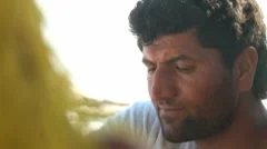 Man Is Working On A Fisher Net