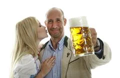 Woman In Dirndl And Man In Leather Trousers 