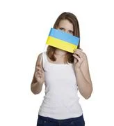 Woman Hides Her Face Behind Flag Of Ukraine