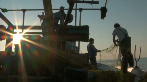 Two Fishers On A Fishing Boat