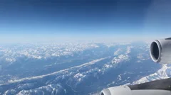 Aerial Plane View With Mountains In The Background Looking Out Of A Plane Window