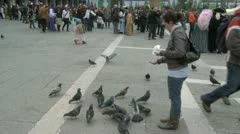 Feeding Pigeons On St. Mark'S Square In Venice