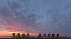 4K Time Lapse Zoom In Red Sunrise Behind Chairs