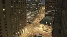 4K Time lapse zoom out aerial traffic intersection at night