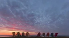 4K Time Lapse Red Sunrise Behind Chairs