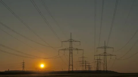 Sunset Wind Turbine And Power Lines