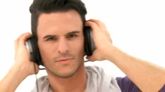 Man Listens To Music With Earphones