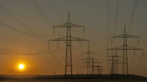 Sunset Wind Turbine And Power Lines