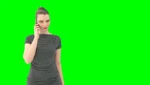 Woman with greenscreen and alpha matte