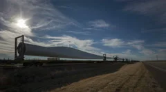 4K Time Lapse Windmill Blades On Cargo Train With Highway