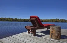 Wooden chairs overlooking a lake