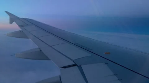 Airplane Wing Above The Clouds