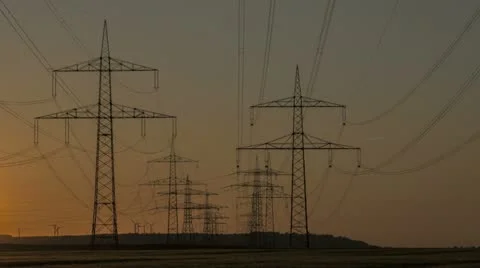Sunset Wind Turbine And Power Lines