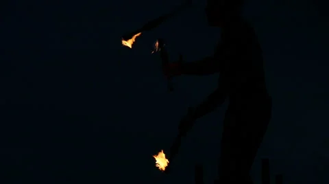 Slowmotion Fire Sticks Juggler Performing