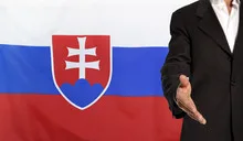 Open hand and Slovakia flag in the background