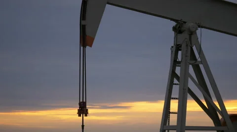 Oil Pump With Sunrise In The Background