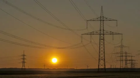 Sunset Wind Turbine And Power Lines