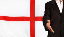 Open hand and England flag in the background