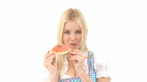 Woman In Dirndl Eats Watermelon
