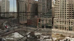 4K Time Lapse Zoom Out Of Traffic On Office Building Reflection