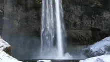 Slowmotion Seljalandsfoss waterfall tilt shot