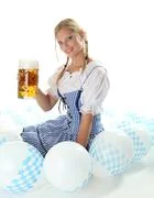 Bavarian Girl Cheers With A Beer