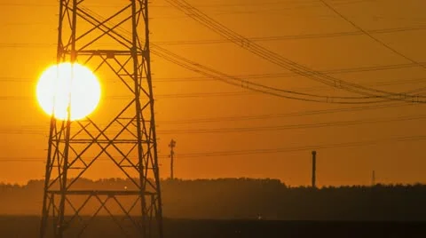 Sunset Wind Turbine And Power Lines