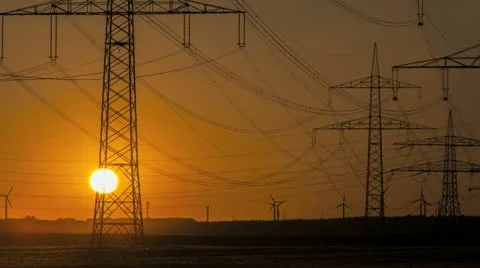 Sunset Wind Turbine And Power Lines