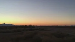 Car In The Desert At Sunrise Pan Shot