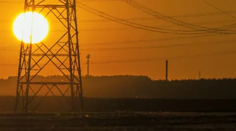Sunset Wind Turbine And Power Lines