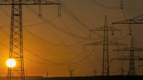 Sunset Wind Turbine And Power Lines