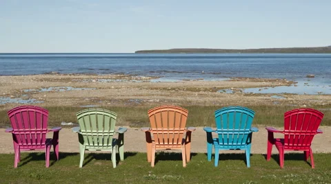 4K Time Lapse Zoom Out Shadow Over Colored Chairs At Lake