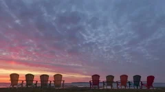 4K Time Lapse Close Up Red Sunrise Behind Chairs